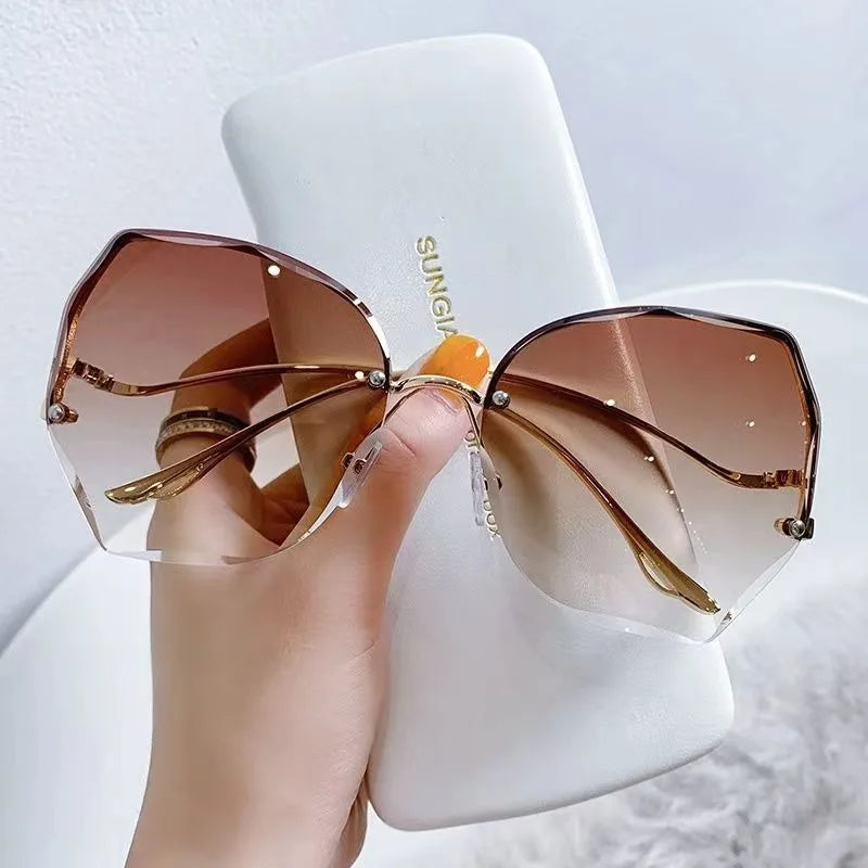 Women's Sunglasses Trendy fashionable polygonal frameless cut edge sunglasses women's metal curved legs retro street photo sunglasses